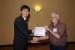 Dr. Jeremy Horne, Program committee Chair, giving Mr. Ryoji Nagai the best paper award of the session "Communication and Network Systems and Technologies" The title of the awarded paper is ''Near-Field Coupling Communication Technology for Human-Area Networking''